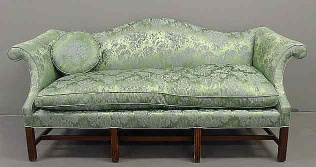 Appraisal: Chippendale style mahogany camelback sofa with green damask upholstery h