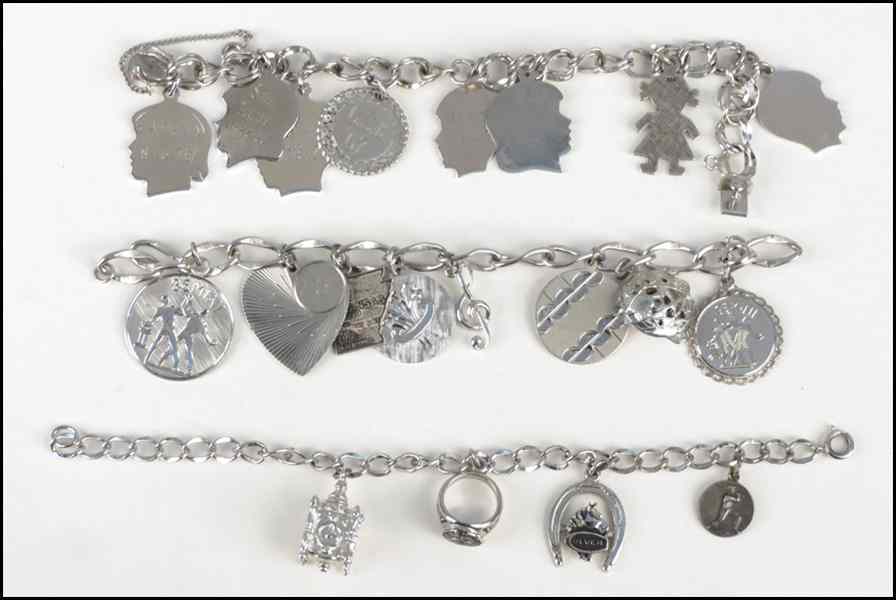 Appraisal: THREE STERLING SIVER CHARM BRACELETS Condition No Specific Condition Recorded