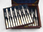 Appraisal: A flame mahogany cased set of twelve pairs of William