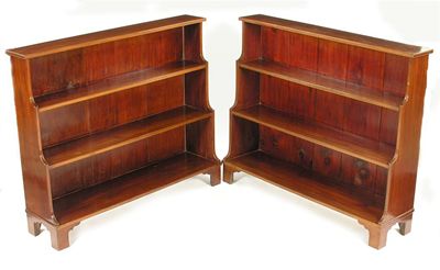 Appraisal: A pair of mahogany waterfall open bookcases in Regency style