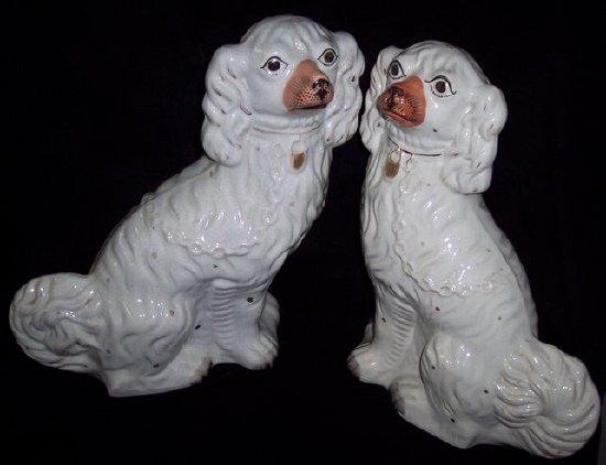 Appraisal: A pair of Staffordshire pottery dogs highlighted in gilt cm