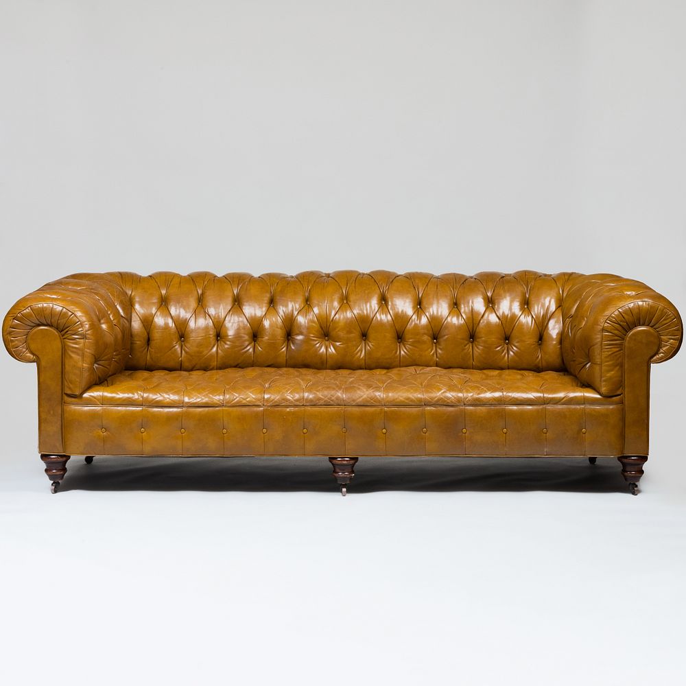 Appraisal: Large English Tufted Leather Chesterfield Sofa Raised on casters x