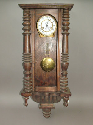 Appraisal: AContinental wooden cased regulator type wall clock the case with