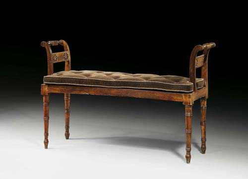 Appraisal: SLENDER BANQUETTE Directoire France circa Pierced and shaped walnut Caned