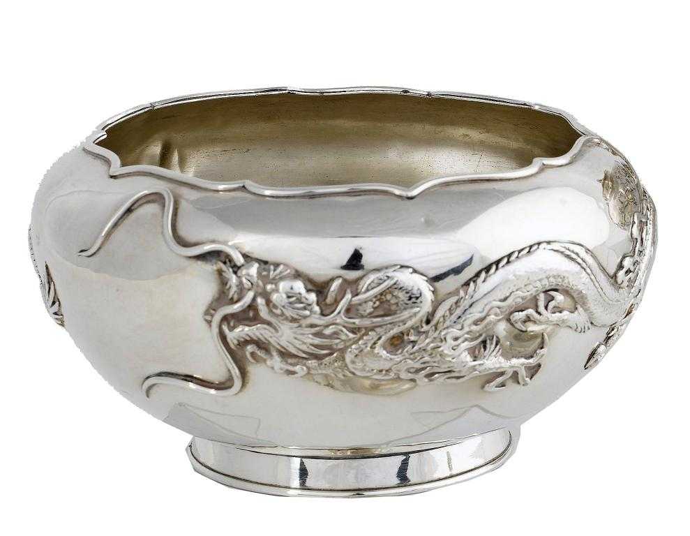 Appraisal: A CHINESE BOWL of compressed circular form applied with dragons