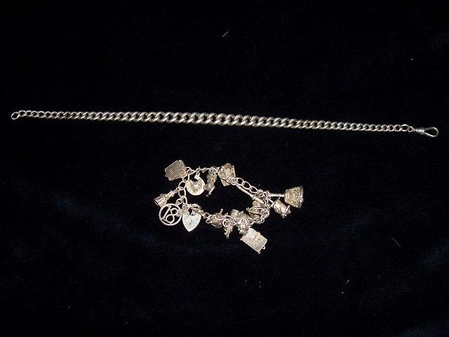 Appraisal: A silver charm bracelet with heart shaped padlock clasp hung