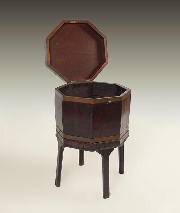 Appraisal: EARLY th C CELLERETTE Mahogany veneer octagonal shape Rests on