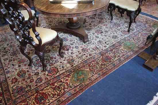 Appraisal: A Persian carpet with field of scrolling foliage on a