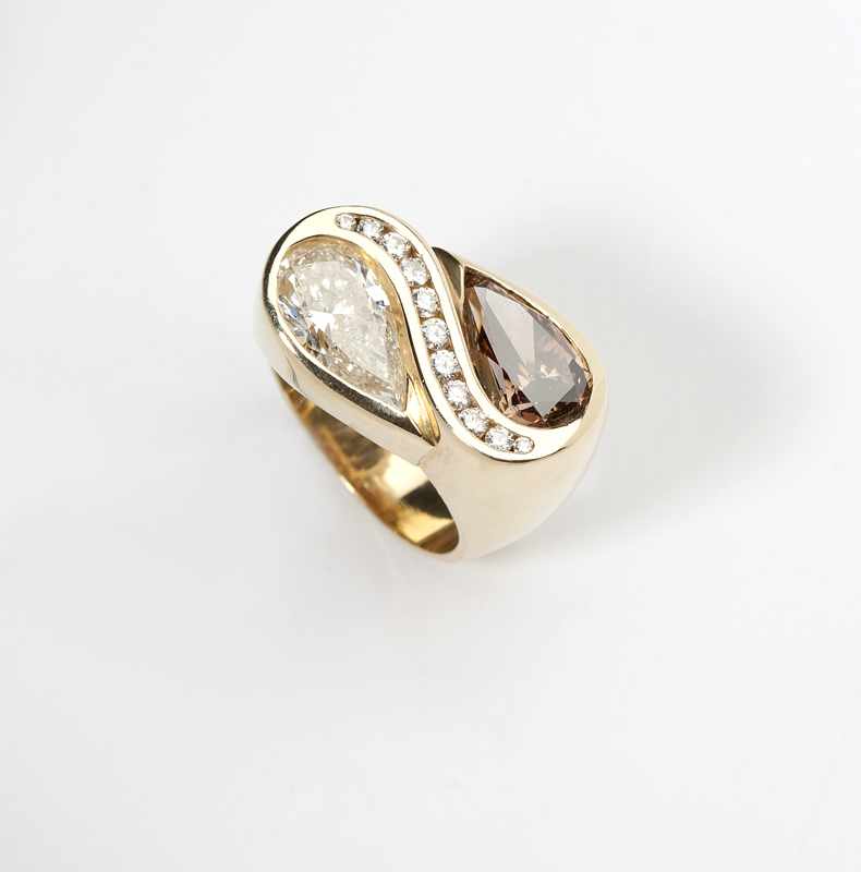 Appraisal: A twin pear-shaped diamond and gold ring K gold set