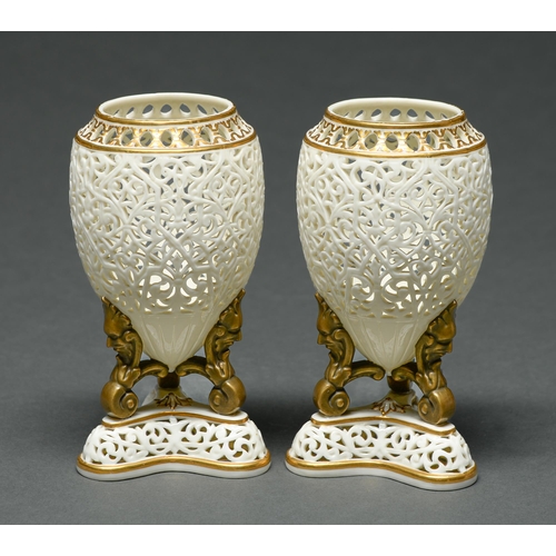 Appraisal: A pair of Grainger's Worcester reticulated vases c on three