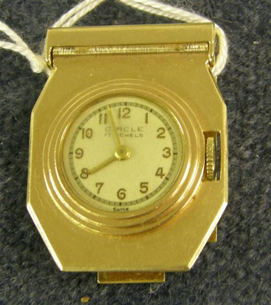 Appraisal: A CIRCLE LADY'S LAPEL WATCH with white enamel dial in