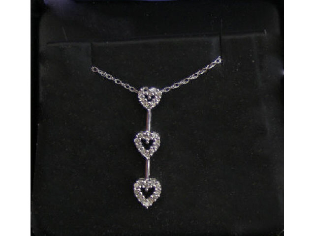 Appraisal: K white gold lady's three heart diamond design pendent retails