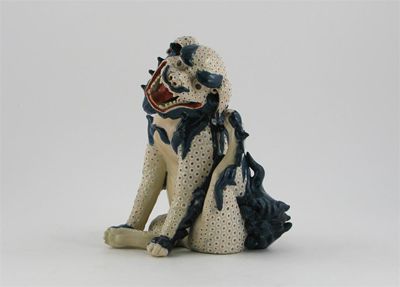 Appraisal: A Japanese Satsuma model of a shi shi sitting scratching