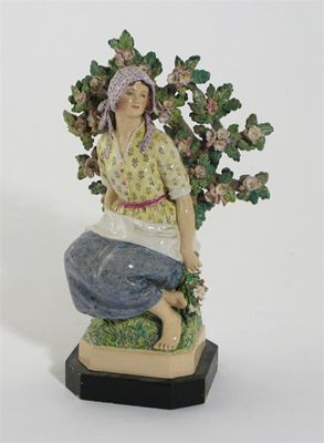 Appraisal: A pottery figure of a peasant woman by Joyce Bidder