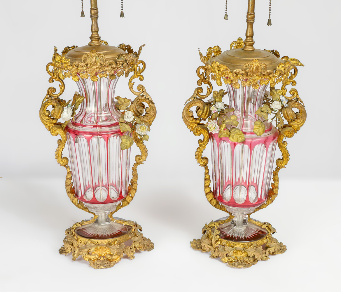 Appraisal: PAIR OF MOSER STYLE METAL MOUNTED LAMPS Cranberry cut to