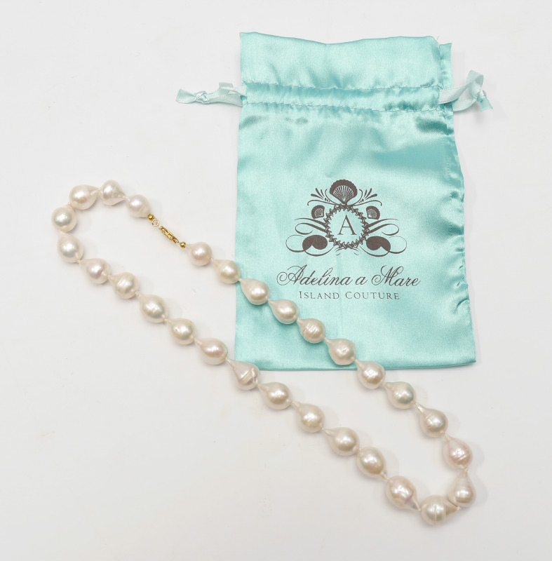 Appraisal: BAROQUE FRESHWATER PEARLS Drop shaped mm with non gold clasp