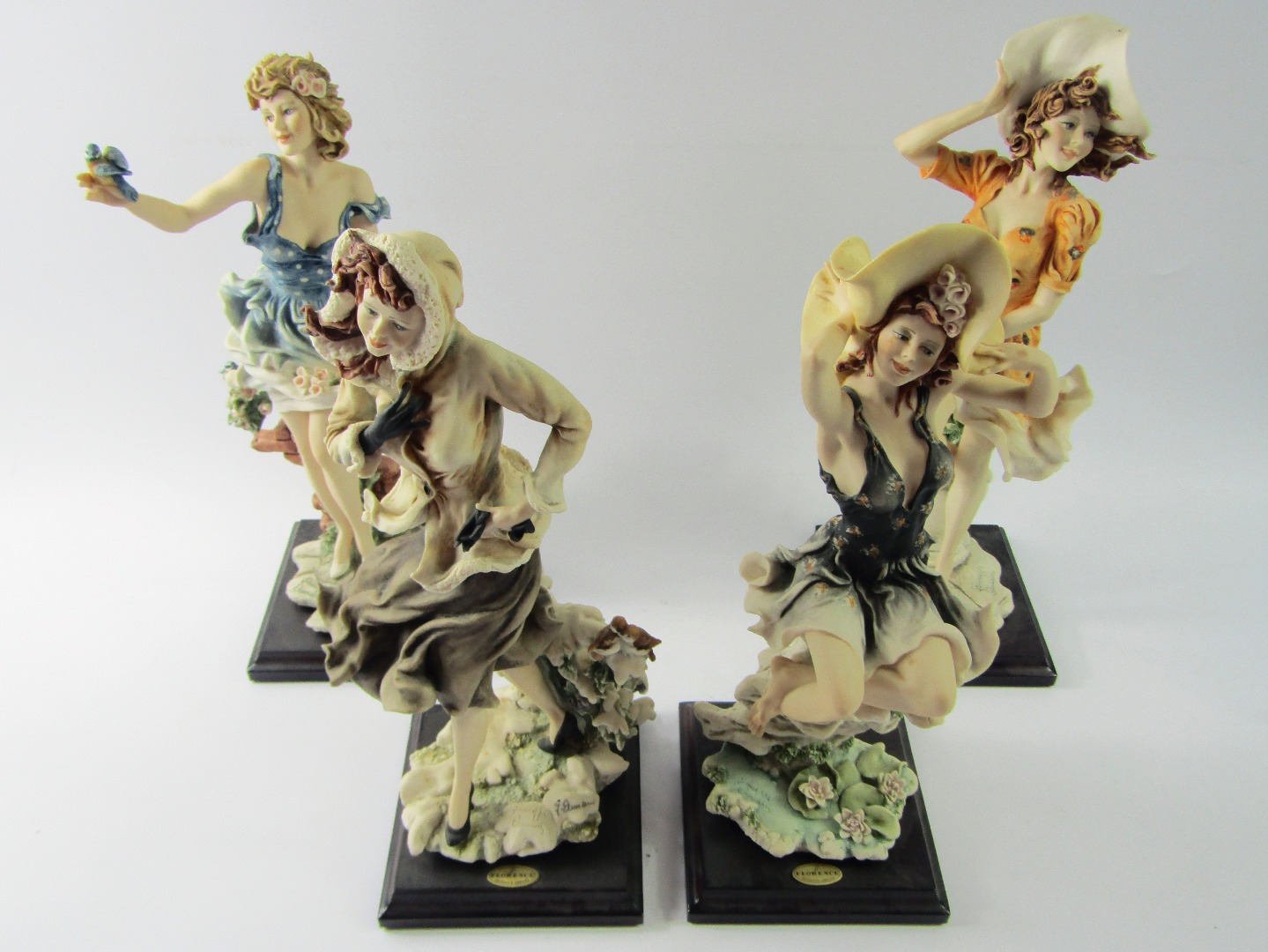 Appraisal: Four Capodimonte Florence figures by Giuseppe Armani comprising Winter Snowflakes