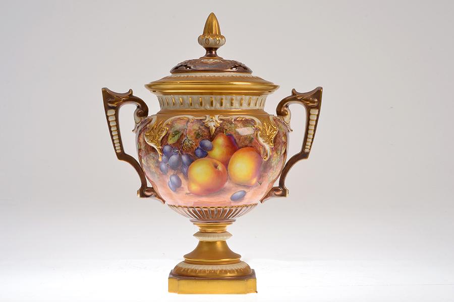 Appraisal: A ROYAL WORCESTER TWO HANDLED POT POURRI VASE AND COVER