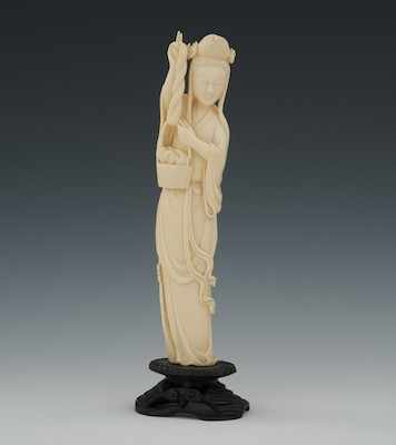 Appraisal: A Carved Ivory Weaver Standing female holding wool in basket