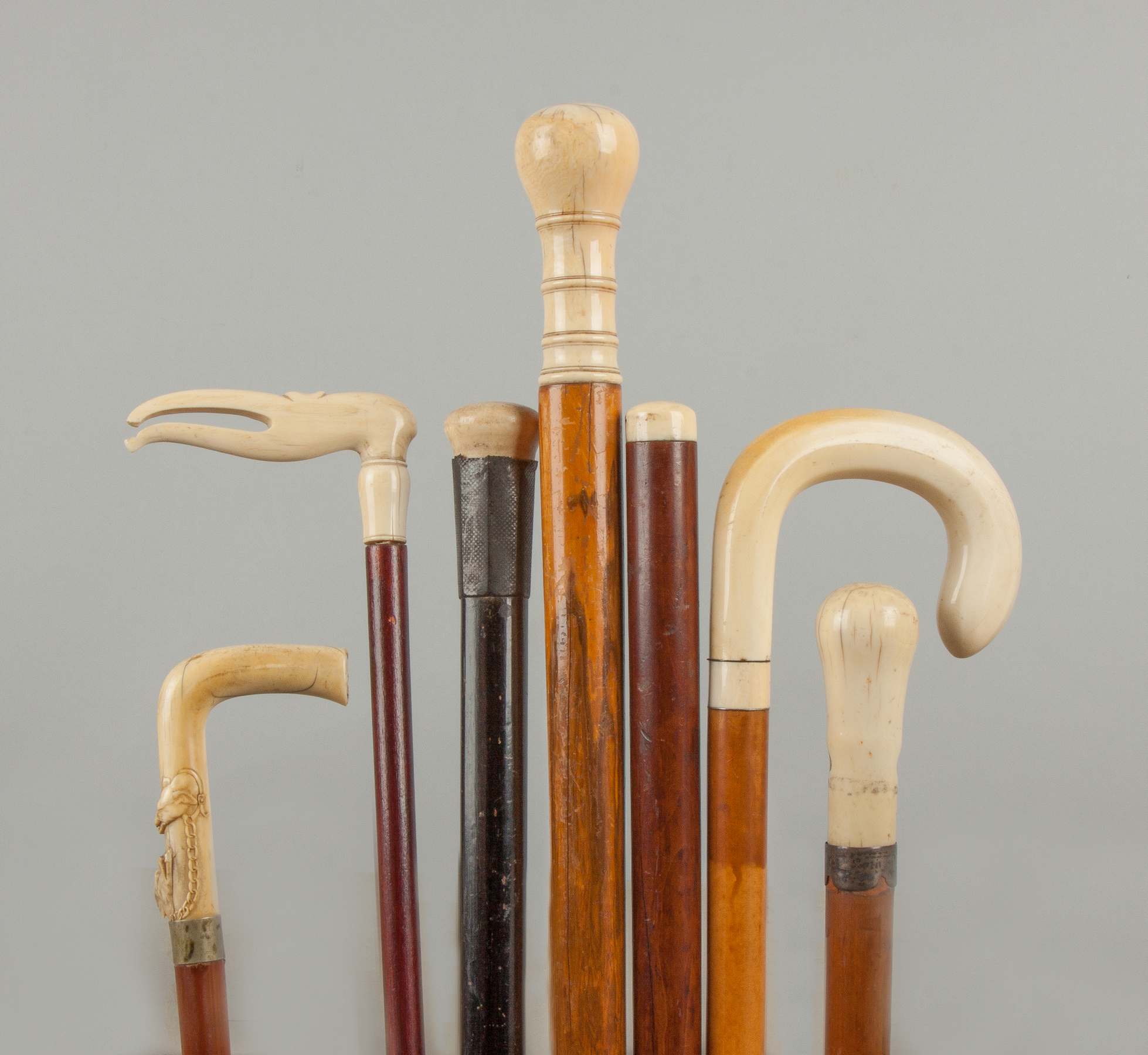 Appraisal: Seven Wood Canes with Carved Handles Late th early th