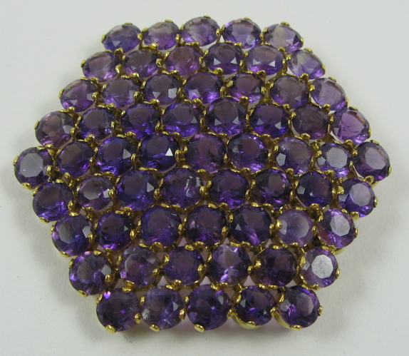 Appraisal: LARGE AMETHYST AND FOURTEEN KARAT GOLD BROOCH of hexagonal shape