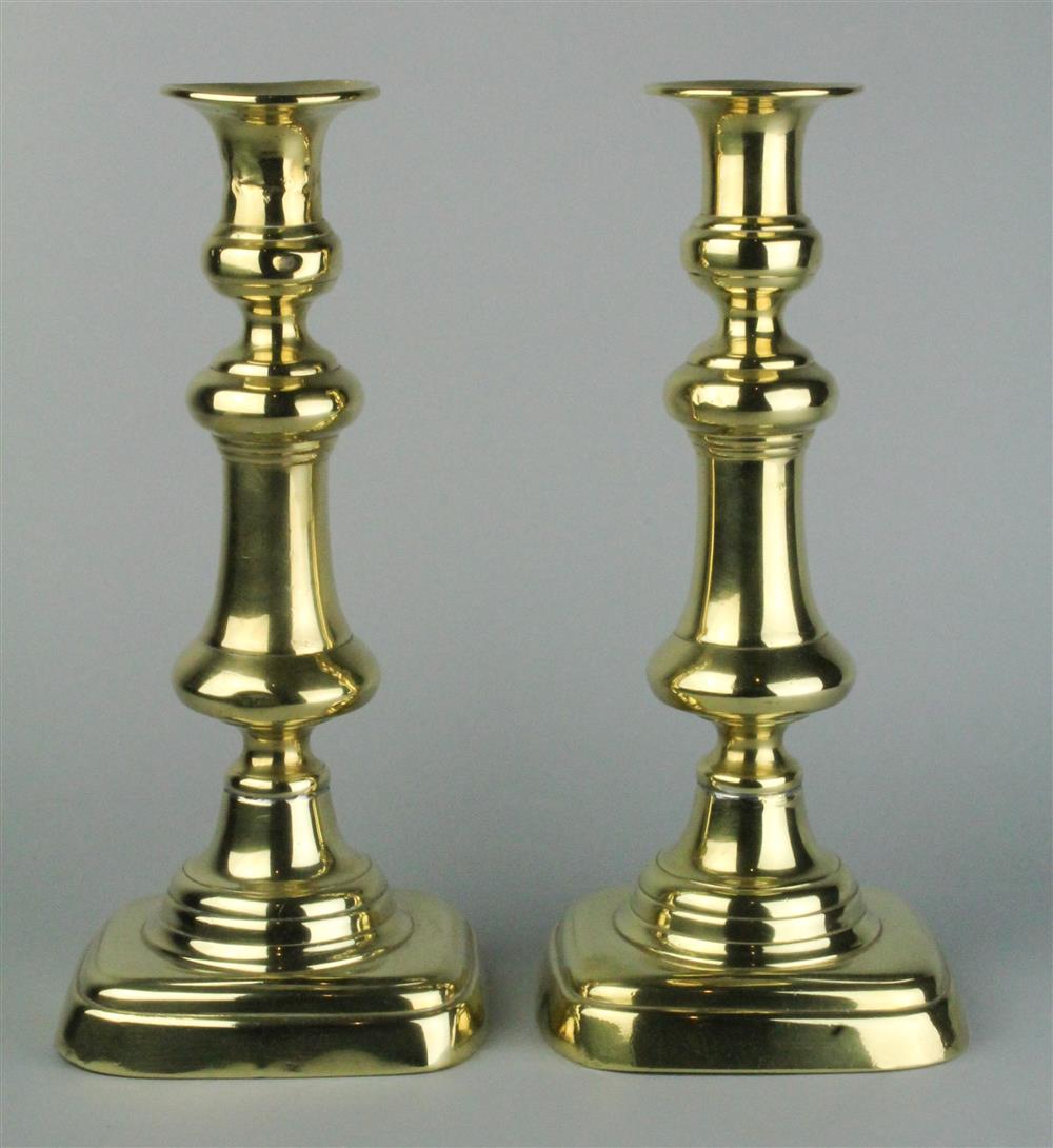 Appraisal: PAIR OF VICTORIAN BRASS CANDLESTICKS th C with urn-form candle