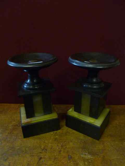 Appraisal: A PAIR OF VICTORIAN BLACK SLATE URN STANDS circular tops