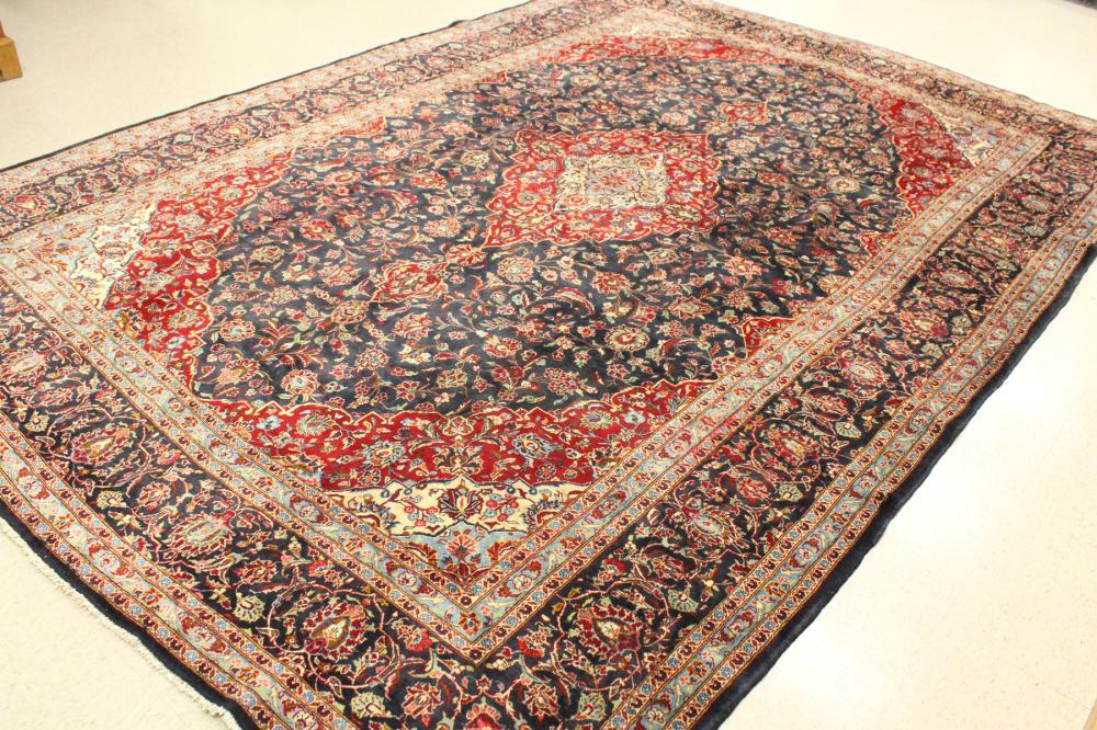 Appraisal: HAND KNOTTED PERSIAN KASHAN CARPET floral and central floral medallion