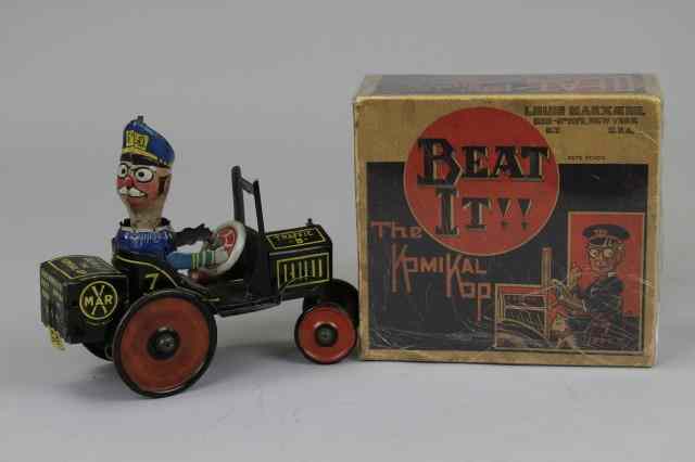 Appraisal: BOXED ''BEAT IT'' KOMIKAL KOP CAR Marx lithographed tin police