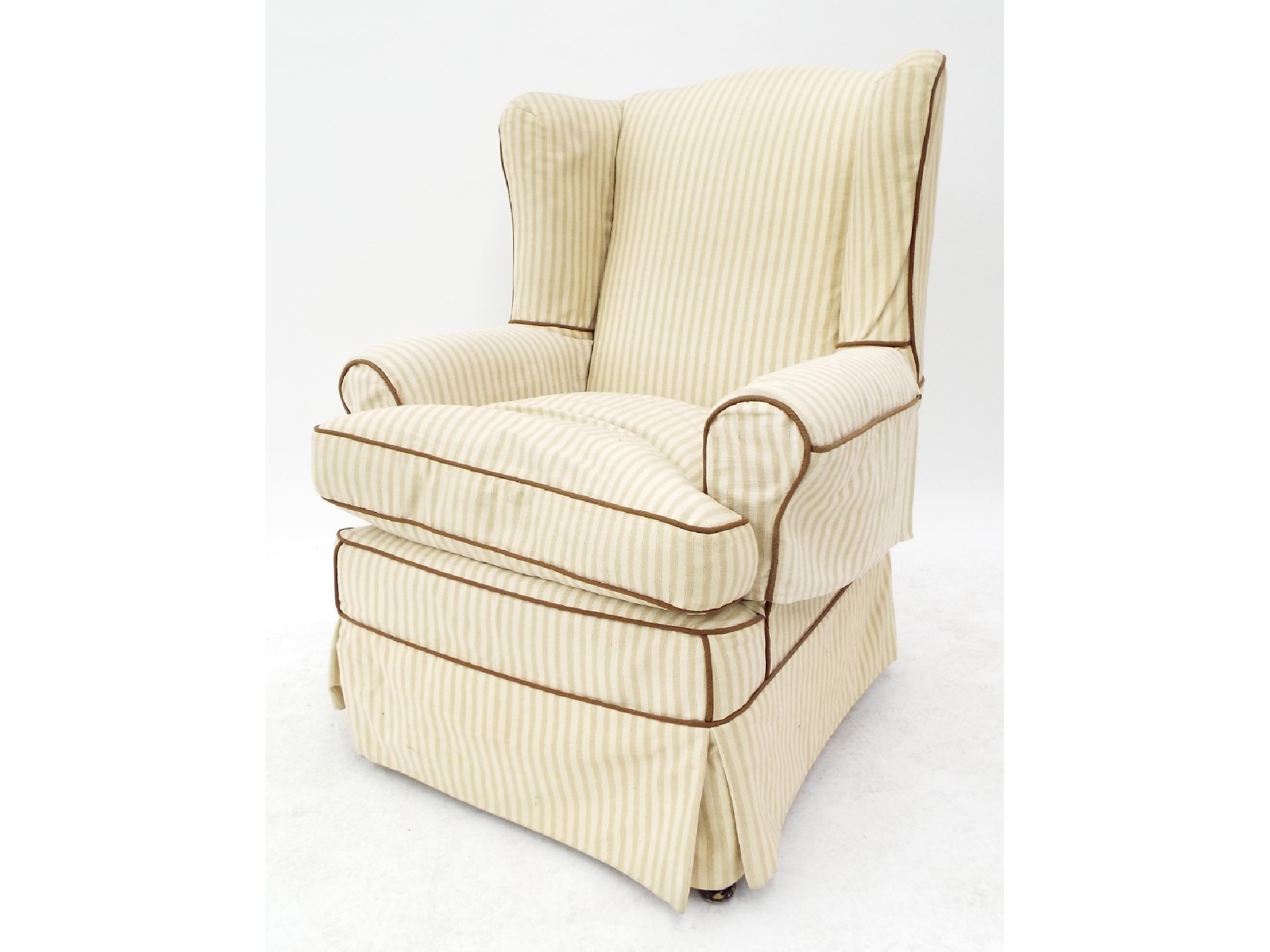 Appraisal: th century wingback armchair with biscuit and cream striped upholstery