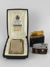 Appraisal: Three cigarette lighters a Ronson Varaflame butane in presentation case