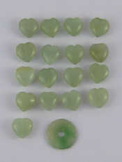 Appraisal: A quantity of jade heart pendants and a jade disc