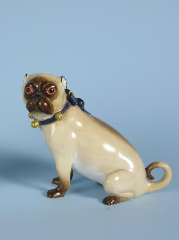 Appraisal: A Worcester seated Pug Dog wearing blue ribbon moulded bells