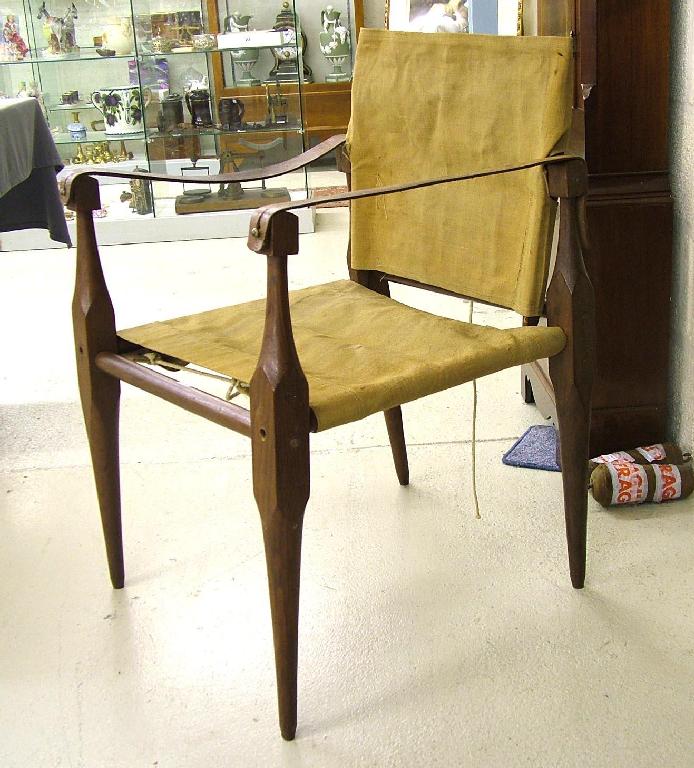 Appraisal: th century mahogany campaign chair with original canvas bags