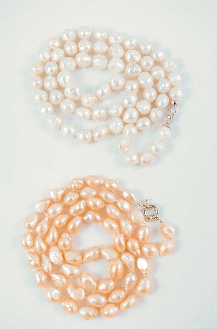 Appraisal: TWO OPERA LENGTH BAROQUE PEARL NECKLACES including a - inch