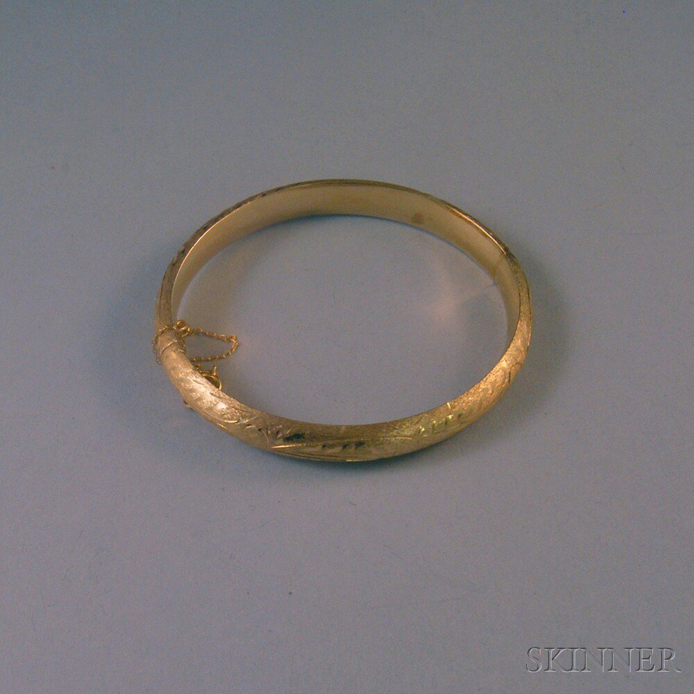 Appraisal: Brushed kt Gold Hinged Bangle Bracelet with subtle foliate motif