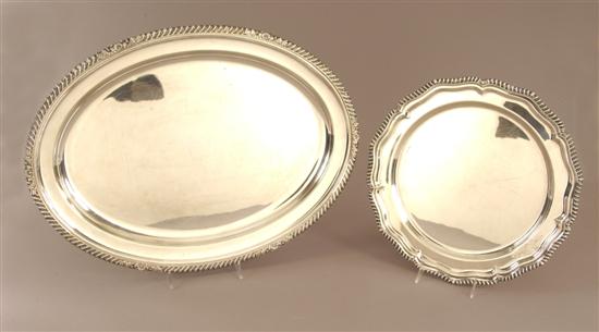 Appraisal: TWO ENGLISH SILVER PLATED SERVING PLATTERS The first a Chippendale