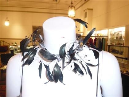 Appraisal: Feathered and beaded choker necklace s- s PROVENANCE The collection