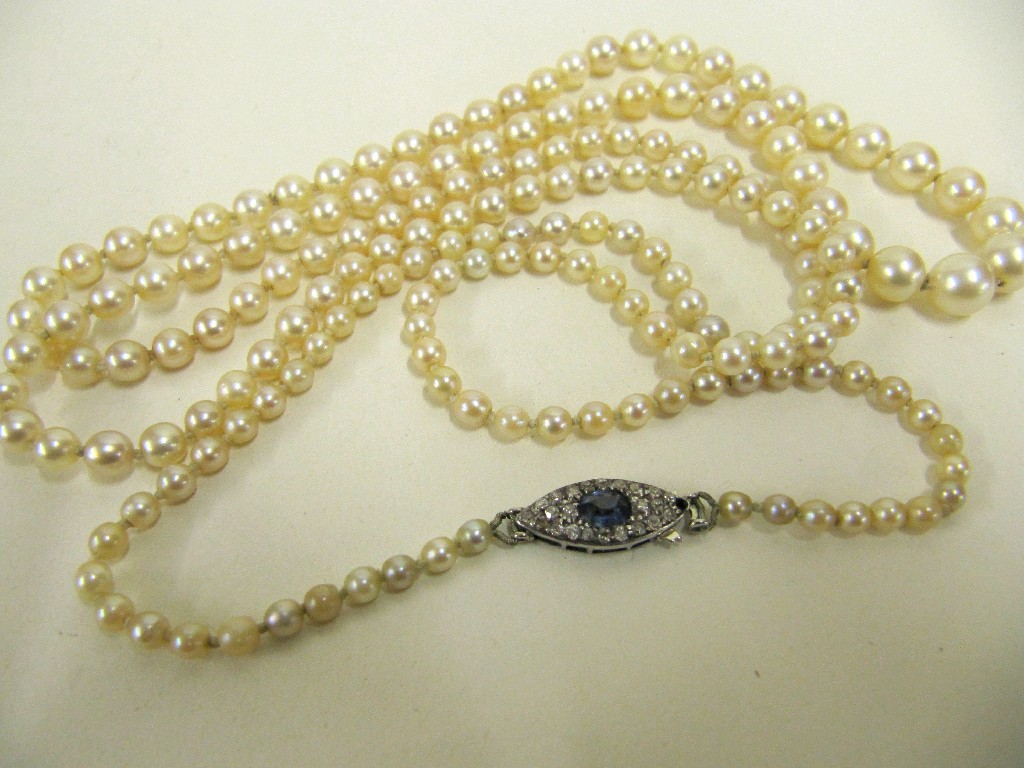 Appraisal: Long string of cultured pearls with ct white gold sapphire