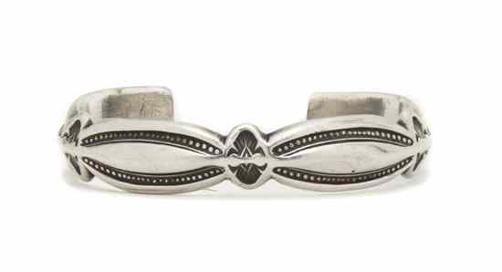 Appraisal: A Sterling Silver Sand Cast Bracelet Harvey Begay Stamped with