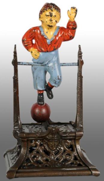 Appraisal: Cast Iron Boy on Trapeze Mechanical Bank Description Circa Manufactured