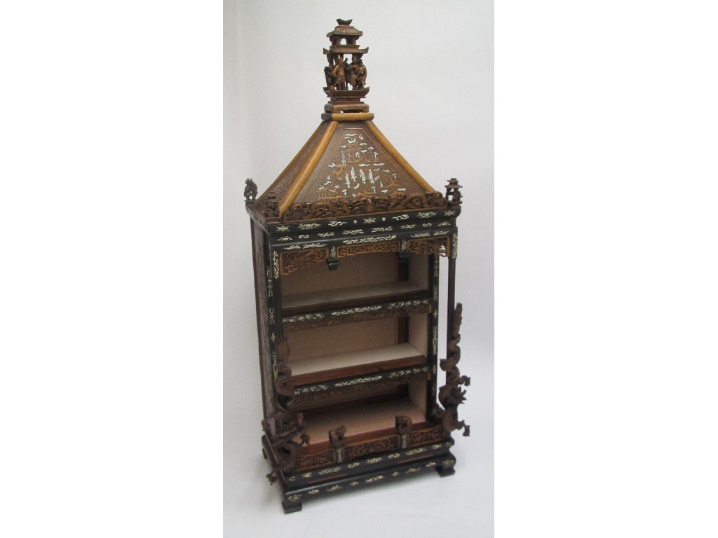 Appraisal: A Chinese devotional display cabinet with carved finial of figures