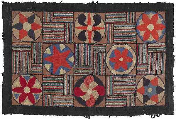 Appraisal: Pennsylvania hooked rug early th c with pinwheels and philphlots