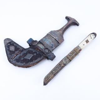 Appraisal: Two Antique Middle Eastern Daggers Leather coming apart creasing to