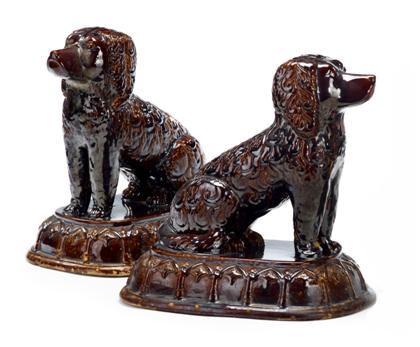 Appraisal: Pair of Rockingham glazed pottery dogs th century