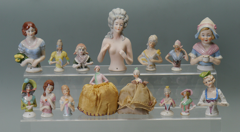 Appraisal: PORCELAIN HALF DOLLS To include the large nude with a