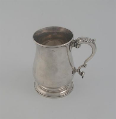 Appraisal: An early George III baluster mug on a spreading foot