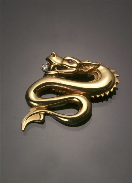 Appraisal: -Karat Yellow-Gold Diamond and Ruby Serpent Brooch Biser The eye