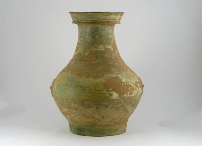 Appraisal: A large Chinese pottery vase with moulded ring handles and