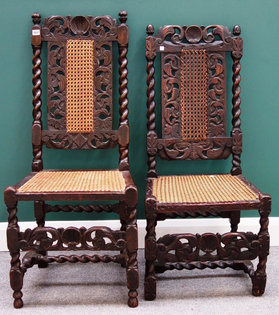 Appraisal: Two similar th century stained beech side chairs with barley-twist